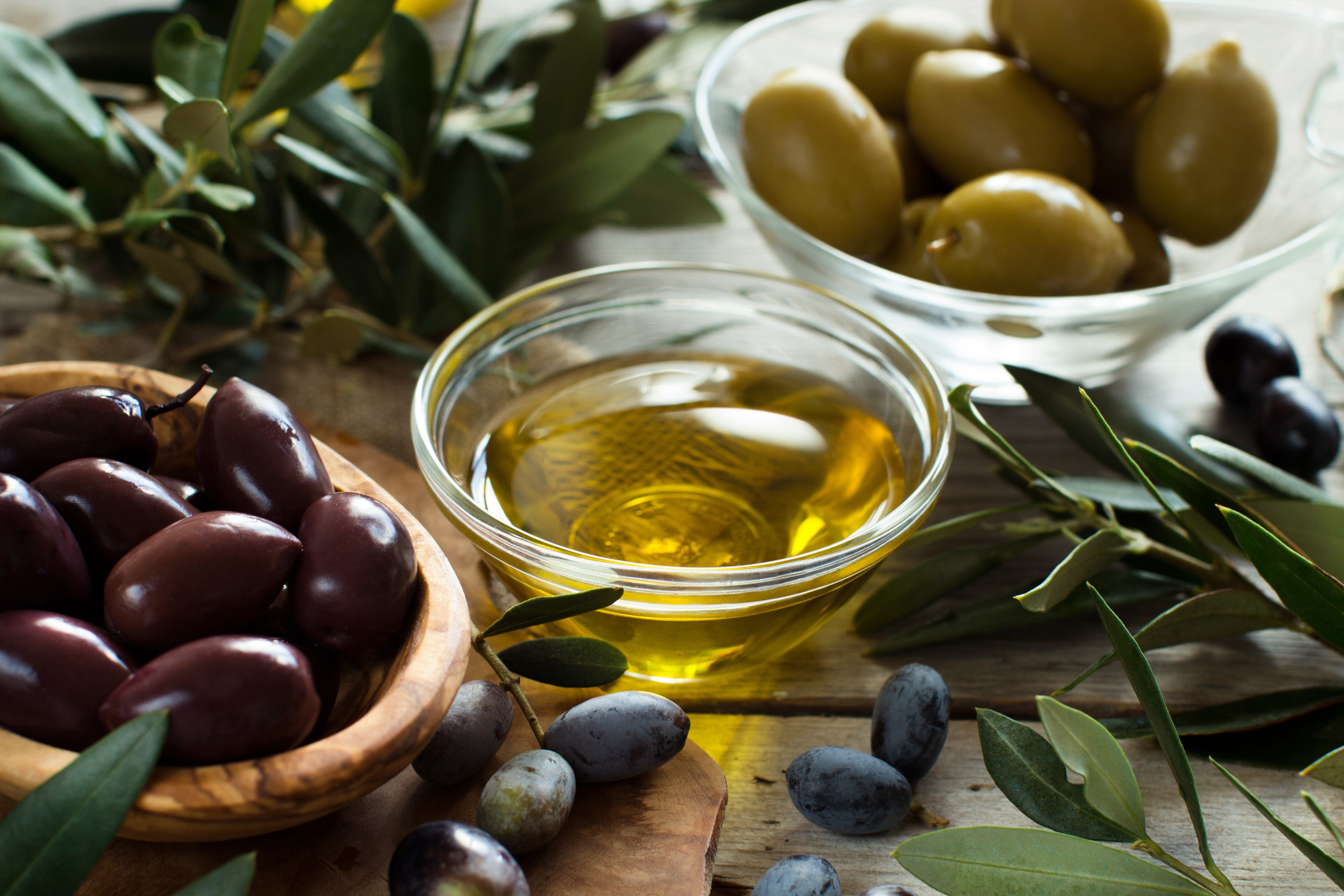 olive-oil-and-olives-on-wood-background-2023-11-27-05-19-03-utc